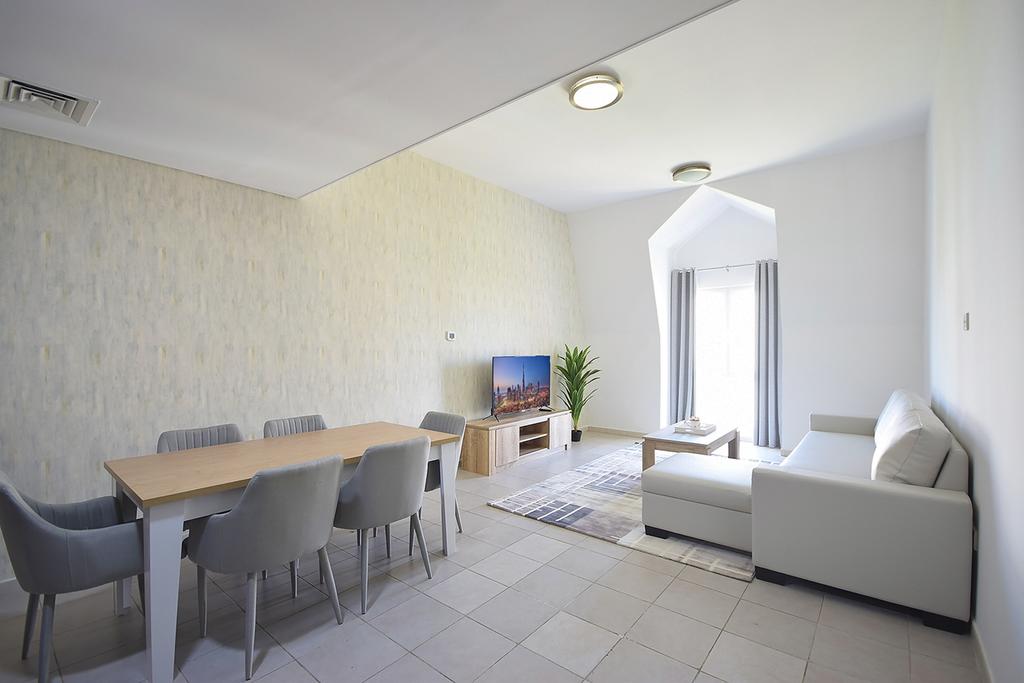 KeyHost - 1BR Discovery Gardens - thumb 0