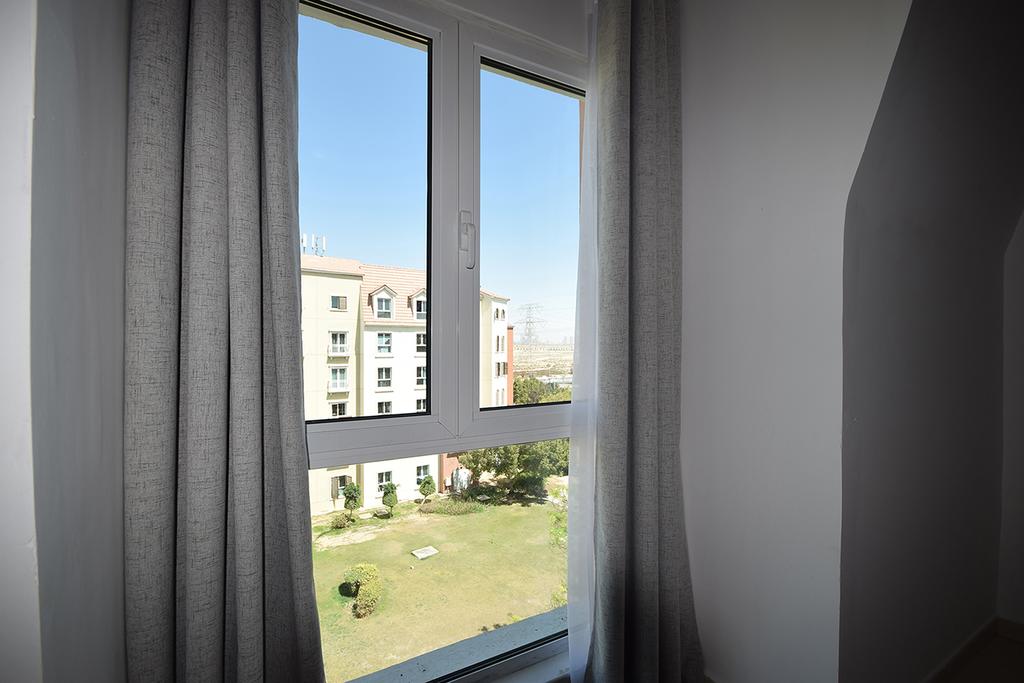 KeyHost - 1BR Discovery Gardens - thumb 1