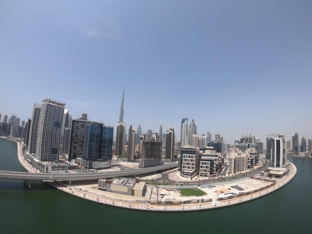 Spacious High-Floor 2BR Apartment With Full Burj Khalifa & Dubai Canal View - thumb 0