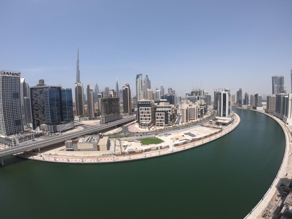 Spacious High-Floor 2BR Apartment With Full Burj Khalifa & Dubai Canal View - thumb 1